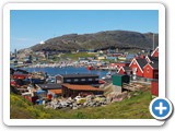 Harbour with working boatyard in foreground
