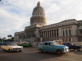 The under restoration National Capitol Building (1926), fronted by the classic cars