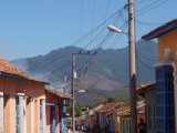 A town side street with the hills in the background