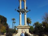 Denise in front of the two column monument to Christoper Columbus